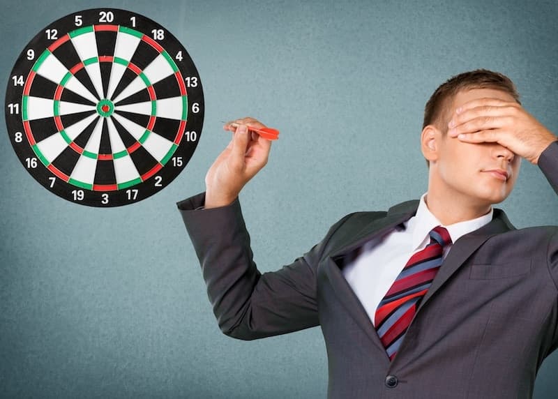 guy blindly throwing darts because he can